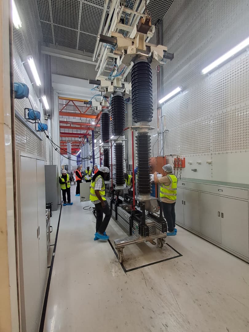 Protrans Energy engineer reviewing substation equipment